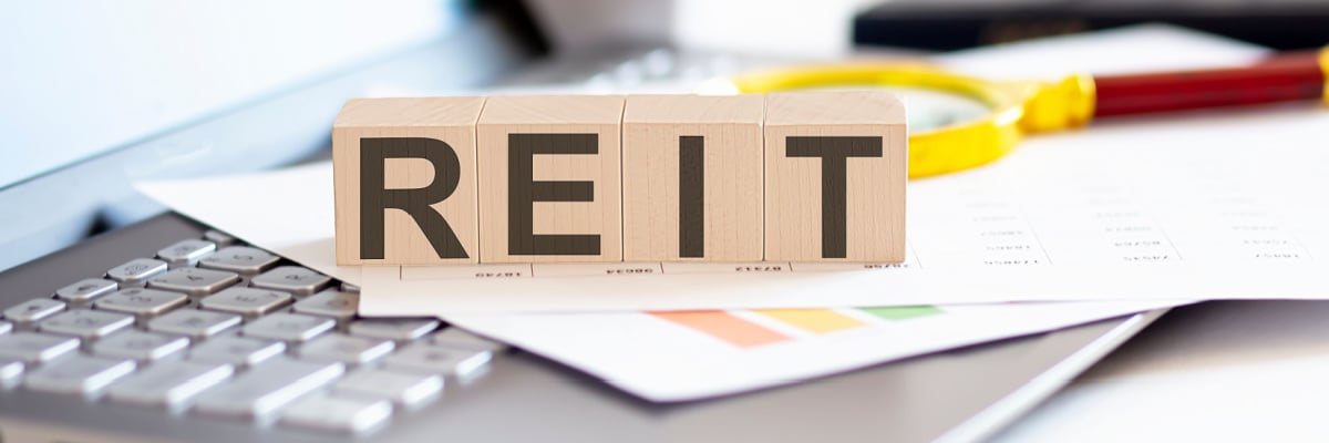 Block letters spelling REIT